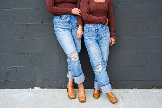 High-Rise Asymmetrical Button Ripped Jeans